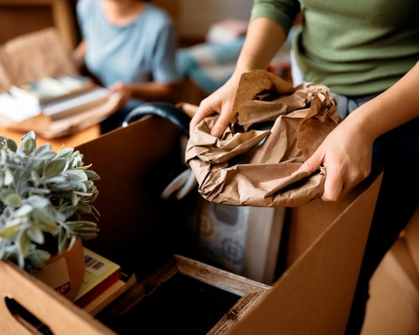close-up-of-woman-unpacking-cardboard-boxes_600